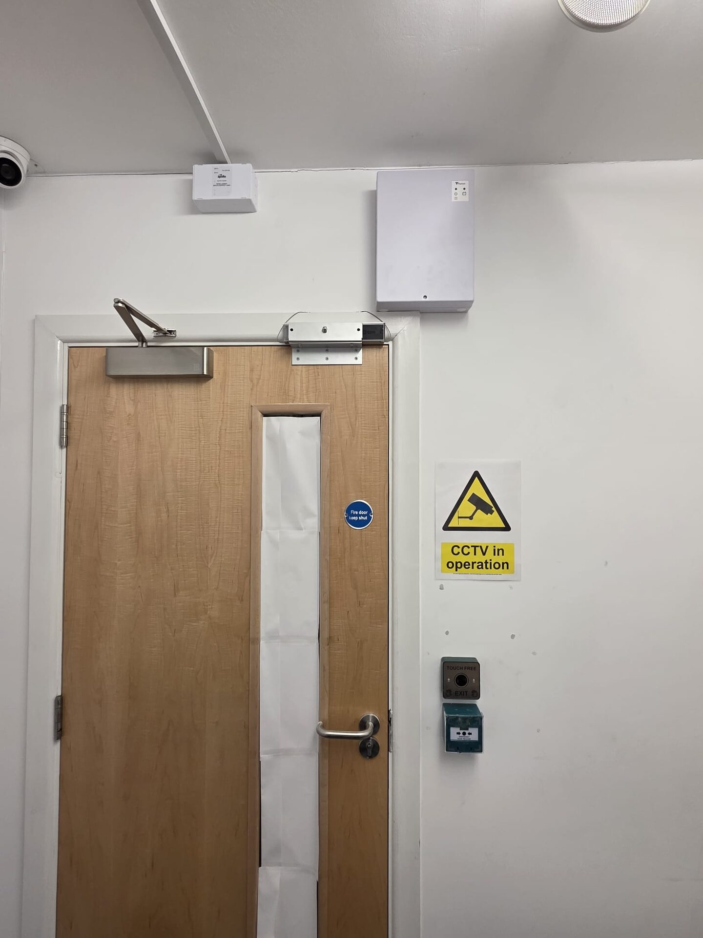 fire exit door with a green release button