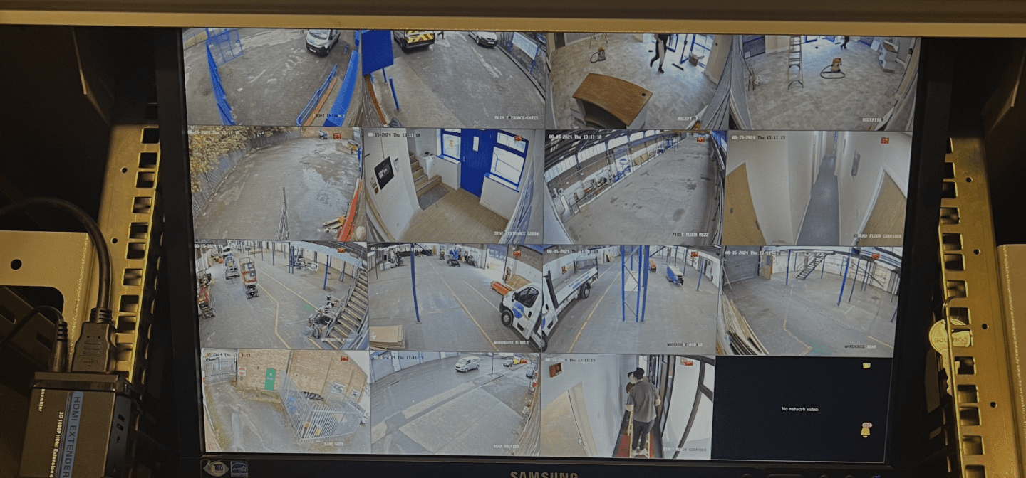 wall of CCTV monitor feeds covering a client site